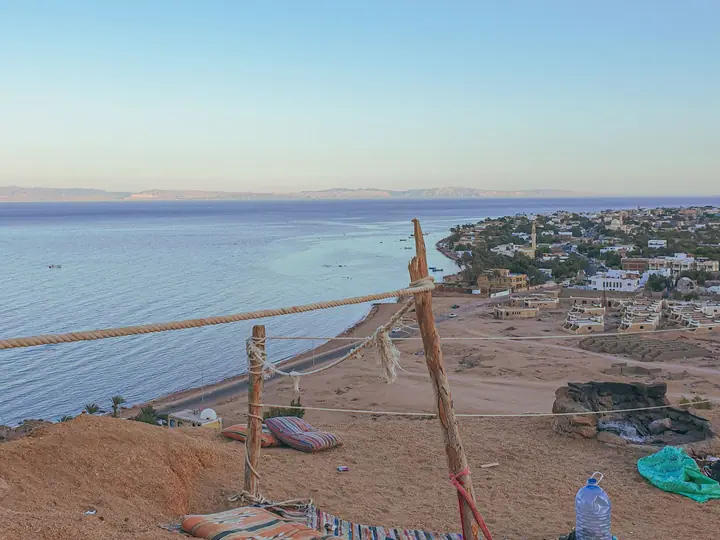Turquoise Red Sea water beside a sandy Egyptian shoreline